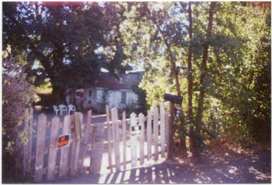 White fence in front of a house